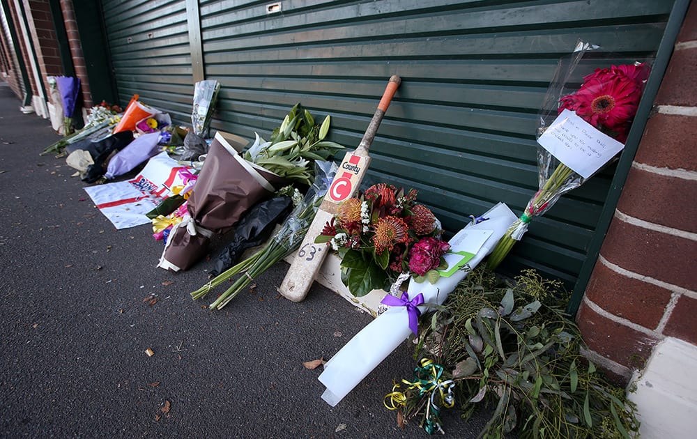 Floral tributes are placed at the entrance to the Sydney Cricket Ground following the death of Australian cricket player Phil Hughes in Sydney.