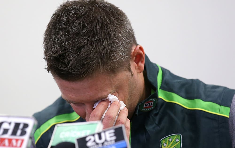 Australian cricket captain Michael Clarke wipes away a tear while making a statement at the Sydney Cricket Ground following the death of Australian cricket player Phil Hughes in Sydney.