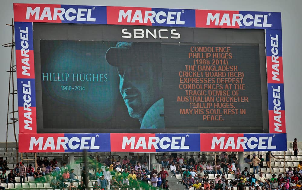 A screen shows a portrait of Australia’s cricket player Phillip Hughes before the fourth one-day international cricket match between Bangladesh and Zimbabwe, in Dhaka, Bangladesh.