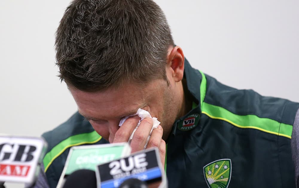 Australian cricket captain Michael Clarke wipes away a tear while making a statement at the Sydney Cricket Ground following the death of Australian cricket player Phil Hughes in Sydney.