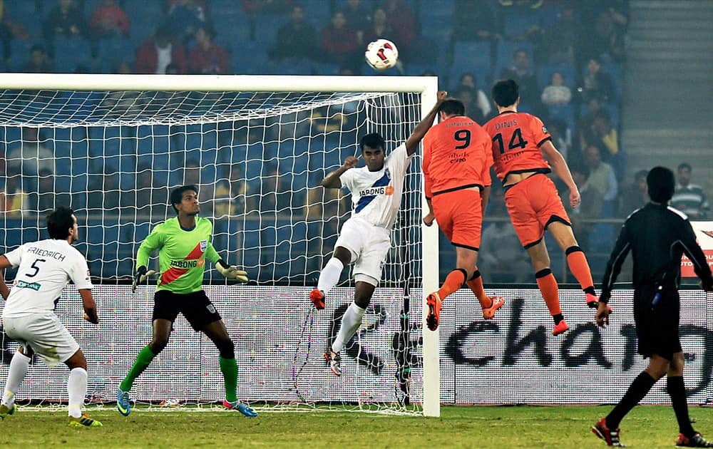 Delhi Dynamos FC (Orange) and Mumbai City FC players in action during their ISL match at Nehru Stadium in New Delhi.