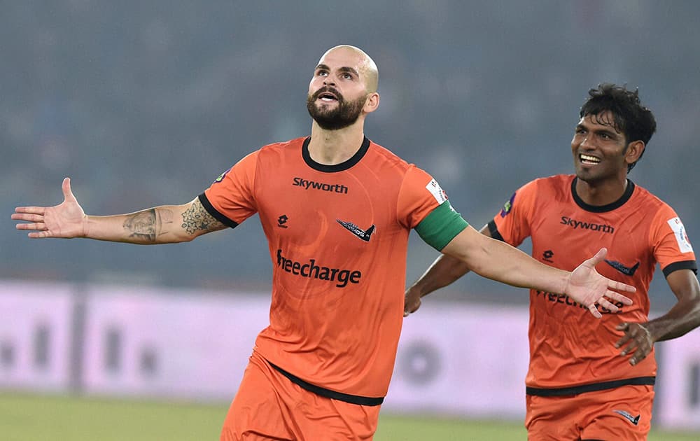 Delhi Dynamos FC captain Hans Mulder celebrates after scoring his sides first goal against Mumbai City FC during their ISL match at Nehru Stadium in New Delhi.