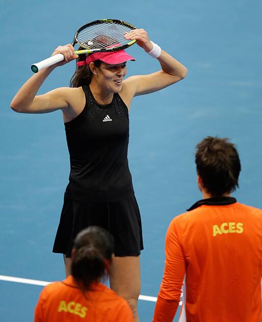 Ana Ivanovic of the Indian Aces reacts to her point during her IPTL (International Premier Tennis League) singles match against Daniela Hantuchova of the Singapore Slammers at the Mall of Asia Arena at suburban Pasay city, south of Manila, Philippines.