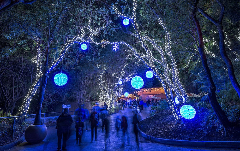 This  photo provided by the Los Angeles Zoo, guests view the first night of a lighted adventure, the inaugural 