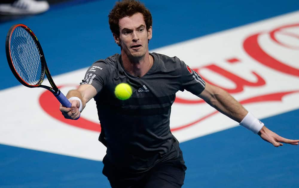 Andy Murray of the Manila Mavericks team returns a shot to Gael Monfils of the Indian Aces during the men's singles of the International Premier Tennis League at the Mall of Asia Arena at suburban Pasay city, south of Manila, Philippines.