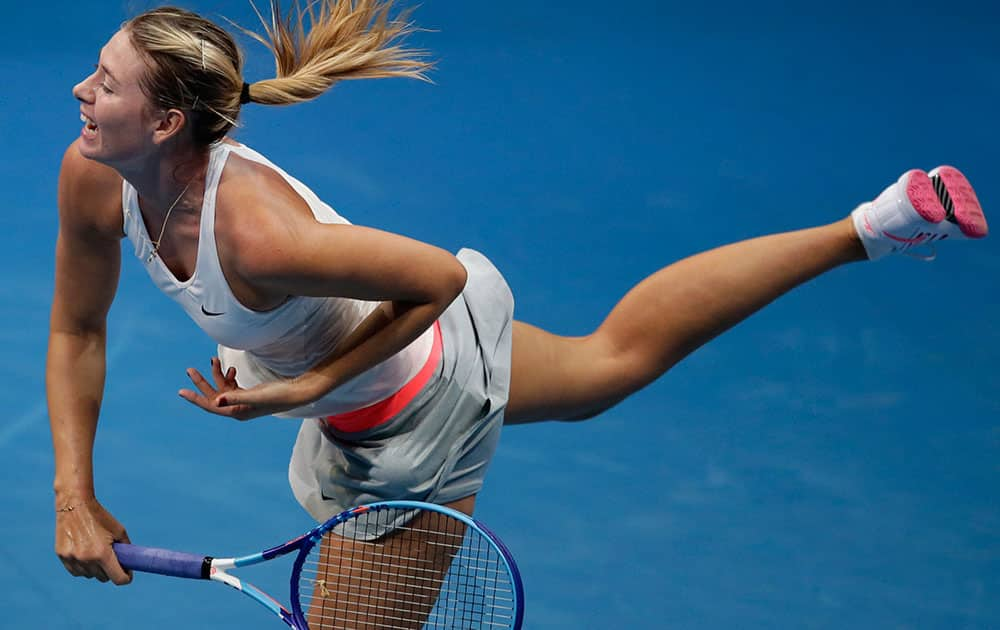 Maria Sharapova of the Manila Mavericks, serves the ball during her women's singles match against Ana Ivanovic of the Indian Aces team, during the women's singles match of the International Premier Tennis League at the Mall of Asia Arena at suburban Pasay city, south of Manila, Philippines.