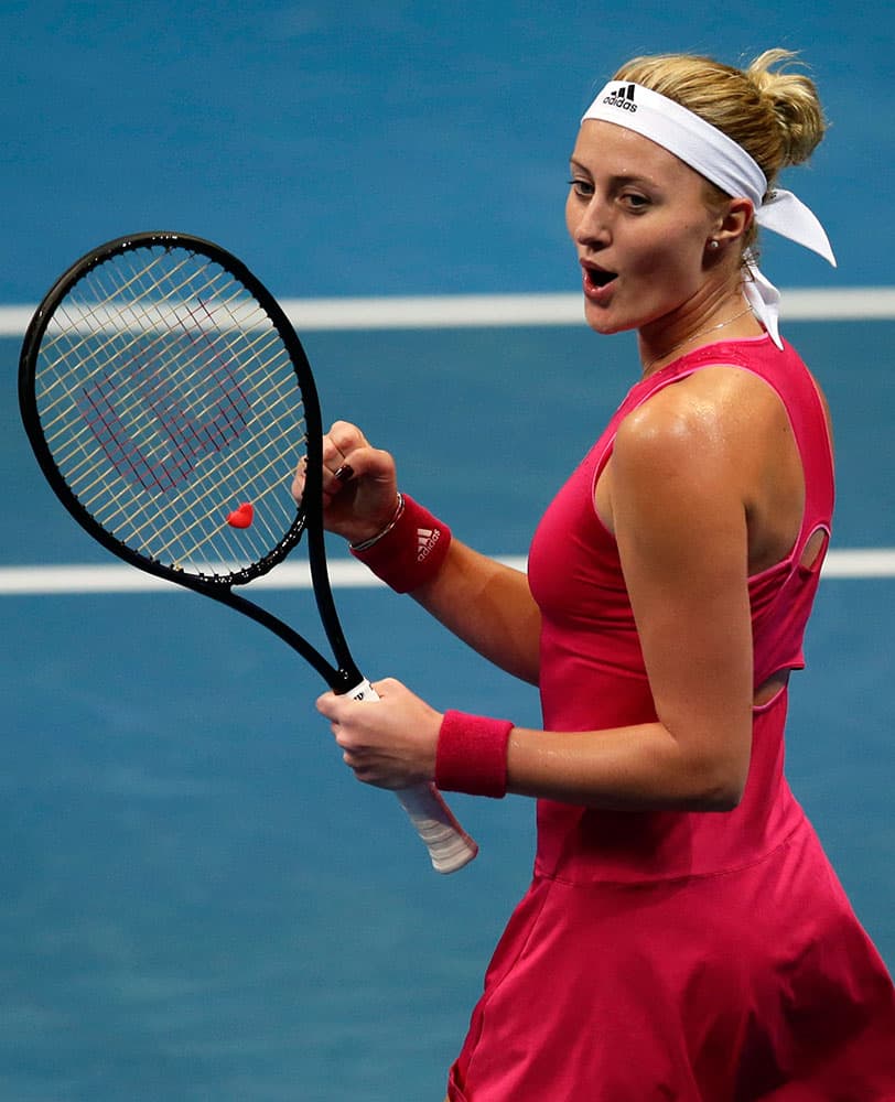 Kristina Mladenovic of the UAE Royals celebrates after getting a point during her women's singles match against Daniela Hantuchova of the Singapore Slammers in the International Premier Tennis League at the Mall of Asia Arena in Pasay city, south of Manila, Philippines.