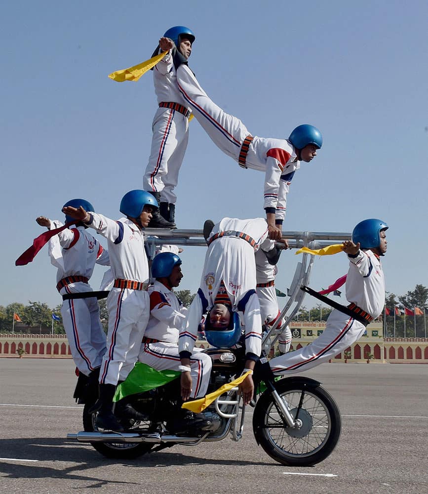 BSF daredevils perform during the 49th Raising Day function of the force in New Delhi.