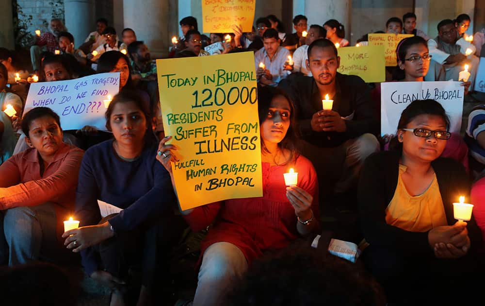 Members of student groups and activists of social organizations participate in a candle light vigil to express solidarity with the Bhopal gas tragedy survivors on the eve of its 30th anniversary in Bangalore.