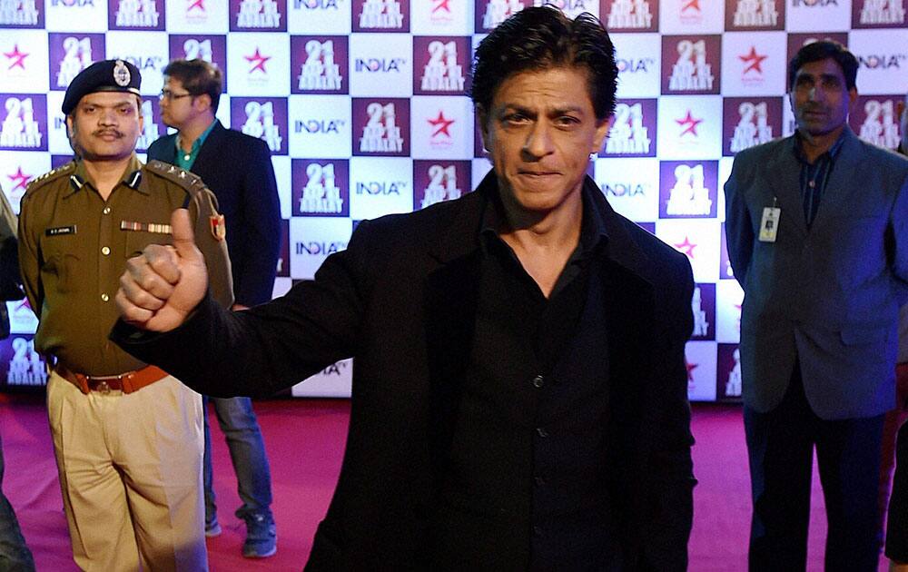 Bollywood actor Shahrukh Khan waves on the Red Carpet, during the celebrations of Aap Ki Adalat (AKA), which has completed 21 years, in New Delhi.