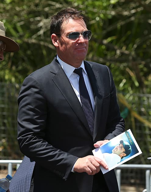 Former Australian cricketer Shane Warne arrives for the funeral of Australian cricketer Phil Hughes in Macksville, Australia.