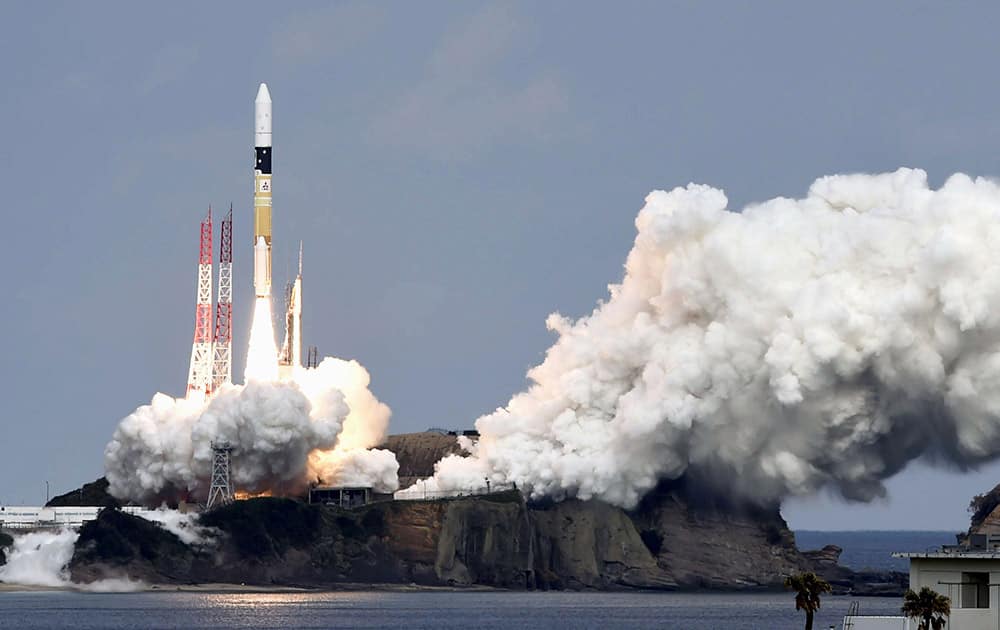 An H2-A rocket carrying space explorer Hayabusa2, lifts off from a launching pad at Tanegashima Space Center in Kagoshima, southern Japan.