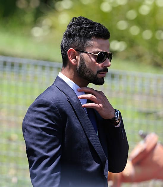 Virat Kohli arrives for the funeral of Australian cricketer Phil Hughes in Macksville, Australia.