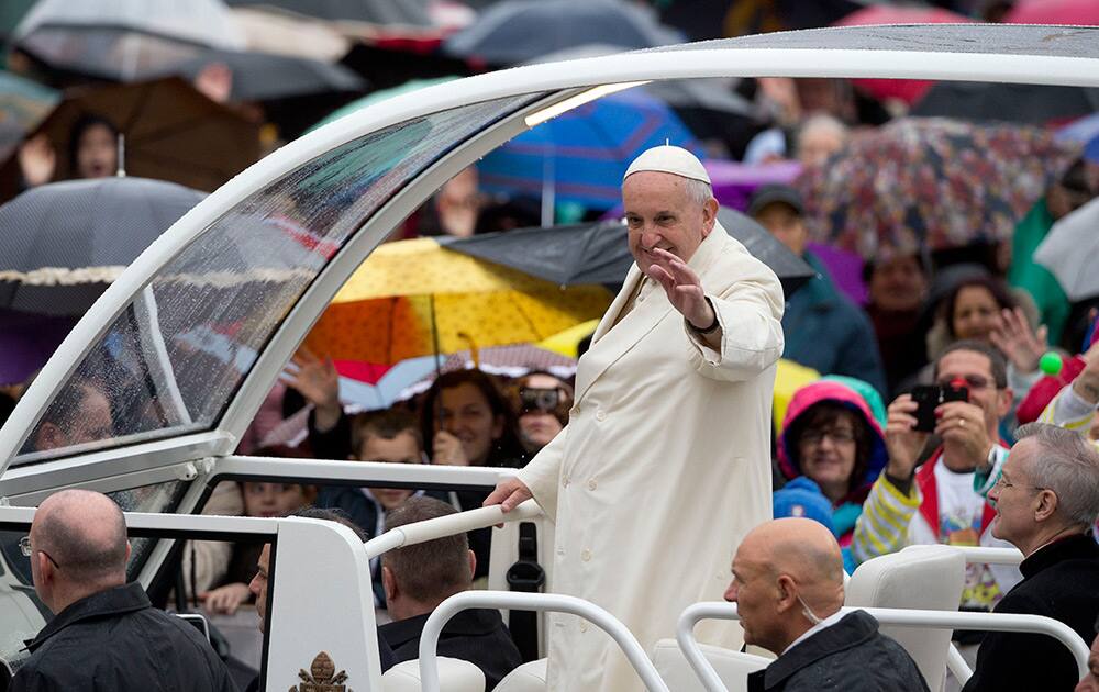 Pope Francis arrives for his weekly general audience in St. Peter's Square at the Vatican.