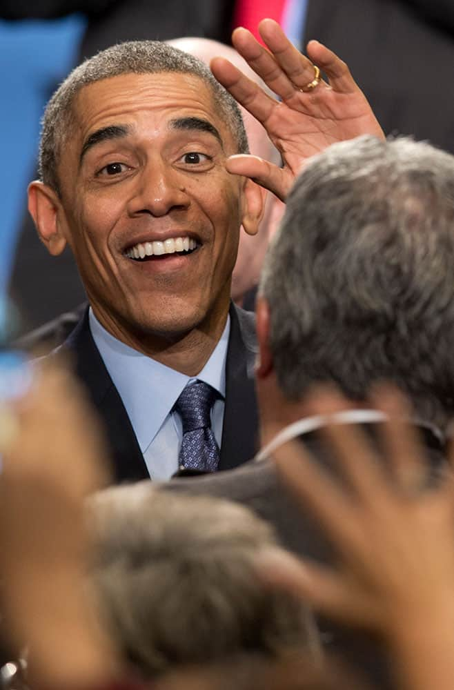 President Barack Obama greets people in the crowd during the 2014 White House Tribal Nations Conference at the Capital Hilton in Washington.