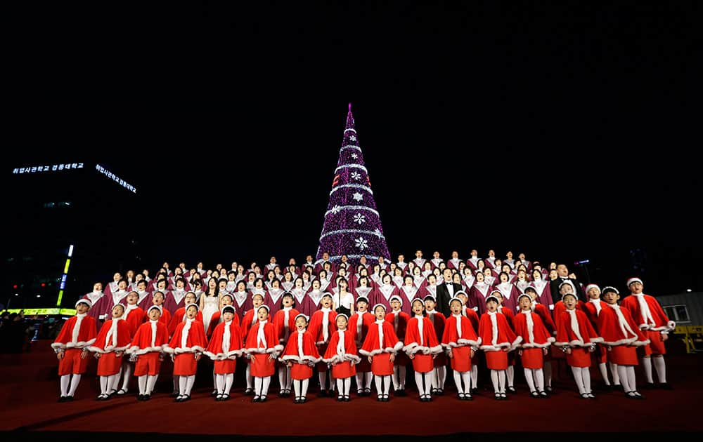 Children and Christians sing during a lighting ceremony of Christmas tree at Seoul City Hall Plaza, South Korea. The country prepares for the Christmas and New Year holidays.