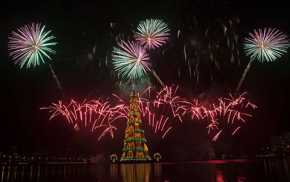 Fireworks explode over the floating Christmas tree in Lagoa lake at the annual holiday tree lighting event in Rio de Janeiro, Brazil.