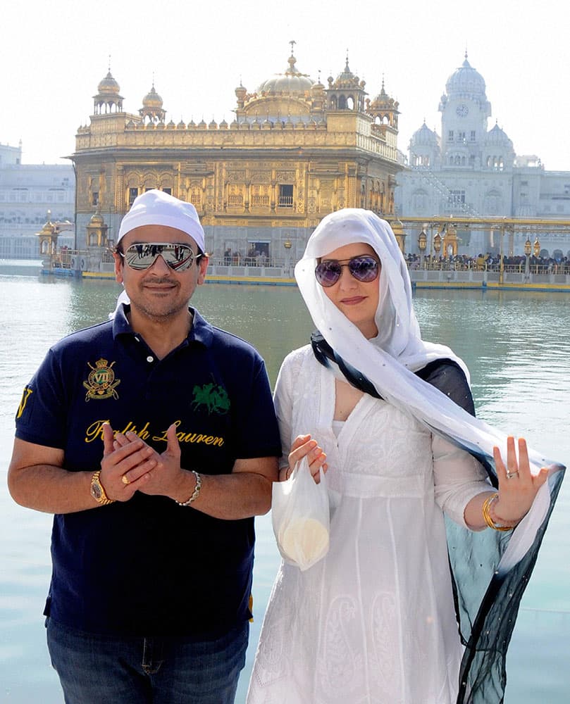 Musician Adnan Sami with his wife Roya Faryabi paying obeisance at Golden temple in Amritsar.