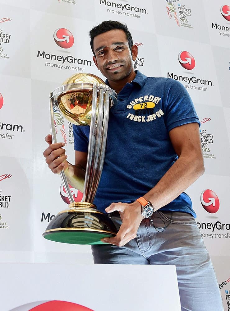 Robin Uthappa with a replica of ICC World Cup 2015 trophy in Bengaluru.