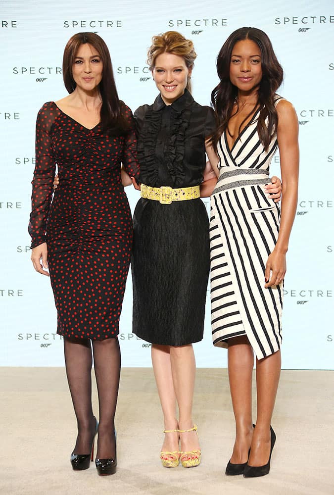 Actresses Monica Bellucci, Lea Seydoux and Naomie Harris pose for photographers at the announcement for the new Bond film, the 24th in the series, at Pinewood Studios in west London.