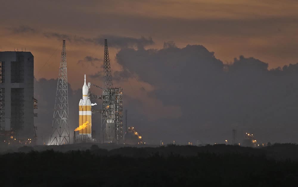 NASA's Orion spacecraft, atop a United Launch Alliance Delta 4-Heavy rocket, sits on the launch pad before its first scheduled unmanned orbital test flight from the Cape Canaveral Air Force Station.