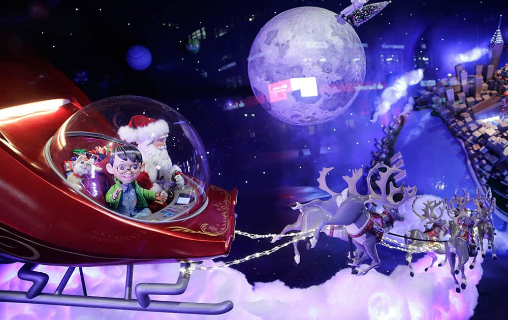 Young explorer Alex and his dog Bella ride in Santa's sleigh as they return to earth in a Macy's department store holiday window in New York. In a series of six displays, an endearing story unfolds of a boy whose magical telescope takes him on a Christmas journey of the planets with none other than Santa Claus.