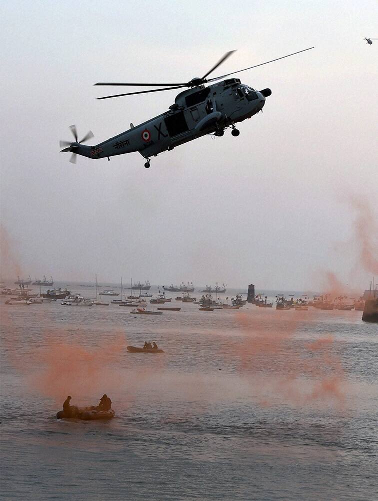 Navy personnel perform during the Navy Day celebrations at Gateway of India in Mumbai.