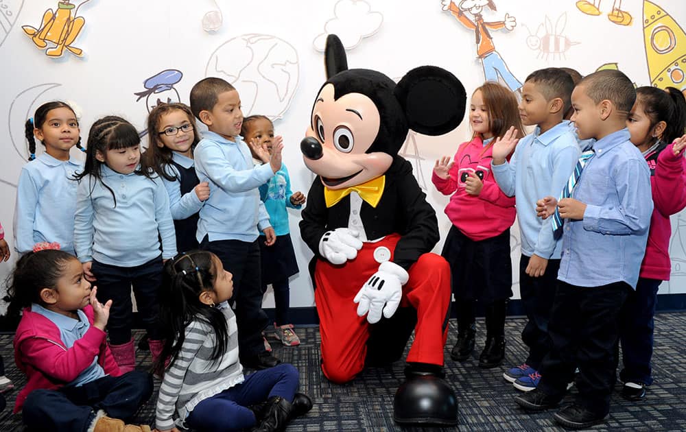 Mickey Mouse and kids celebrate the launch of Disney Imagicademy, a new innovative learning initiative designed for families with children 3 to 8, at The Intrepid Sea, Air & Space Museum in New York. 