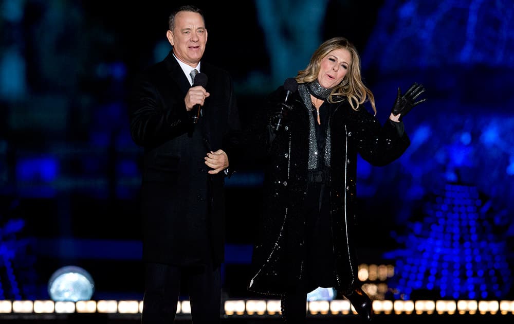 Tom Hanks, and Rita Wilson arrive on stage during the National Christmas Tree lighting ceremony at the Ellipse near the White House in Washington.