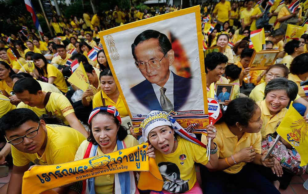 Well-wishers carrying portraits and banners, gather to celebrate the 87th birthday of Thailand's King Bhumibol Adulyadej, at the Siriraj Hospital where the kin has been hospitalized since early October , in Bangkok, Thailand. 