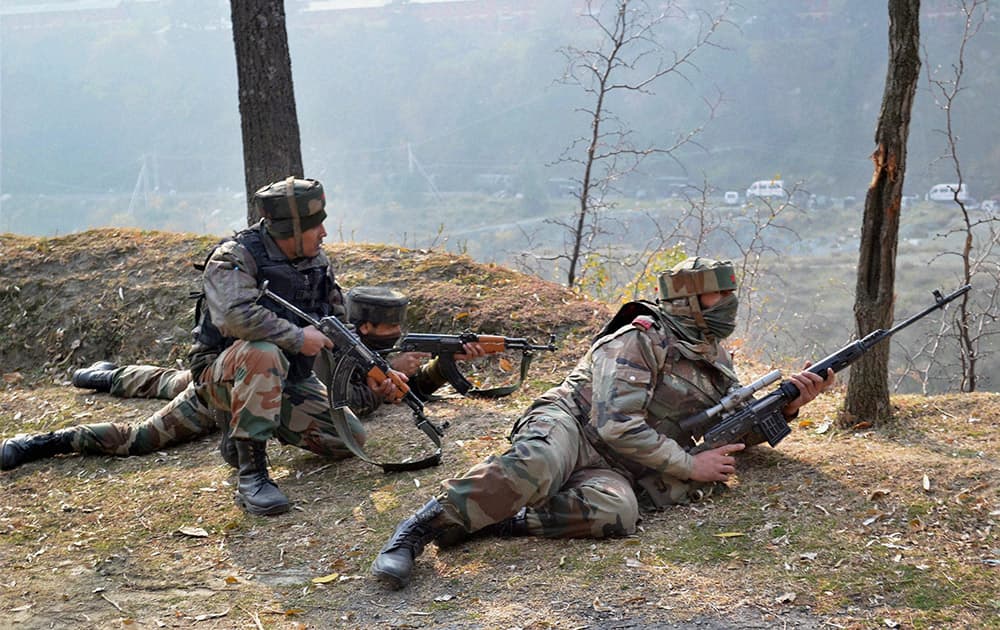 Army personnel take position after the suicide attack by militants at Mohura Army camp, in Uri.