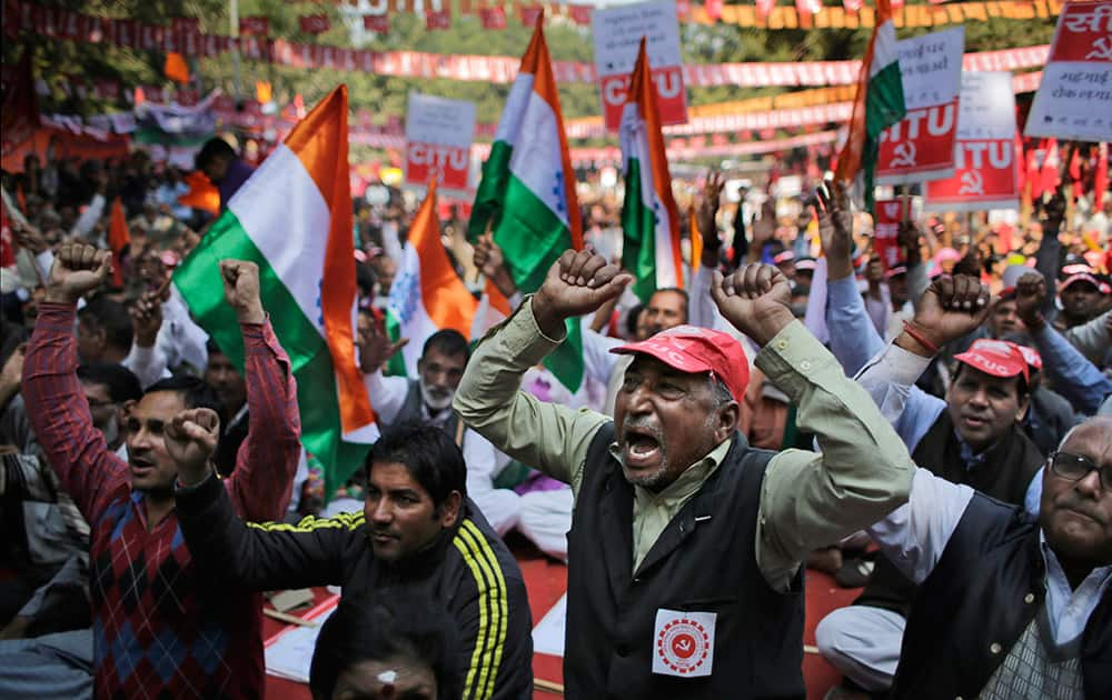 Workers shout anti-government slogans during a protest against alleged anti-worker and pro-corporate policies of the government in New Delhi.