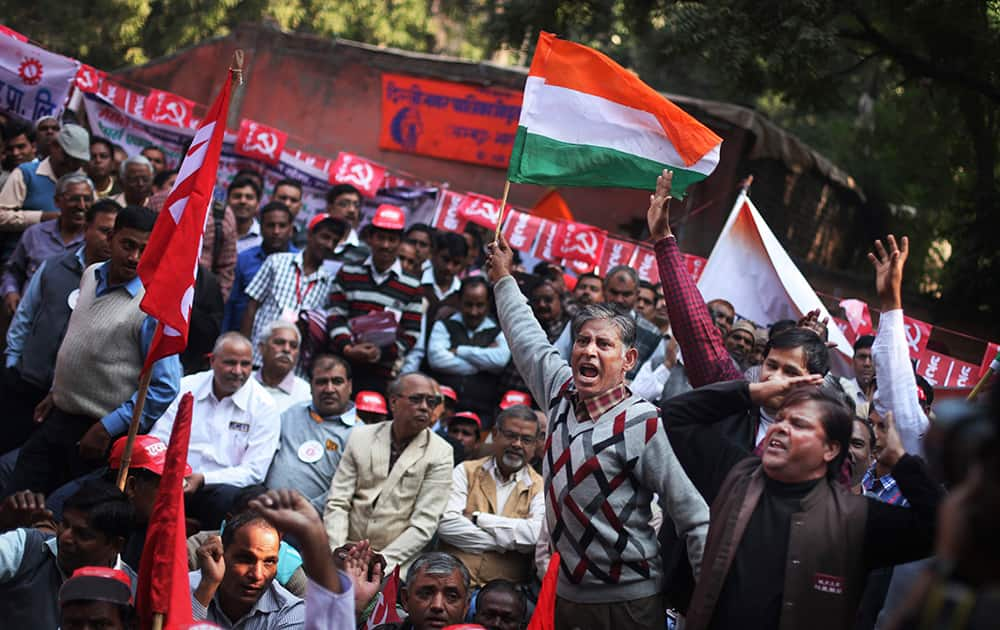 Workers shout anti-government slogans during a protest against alleged anti worker and pro-corporate policies of the government in New Delhi.