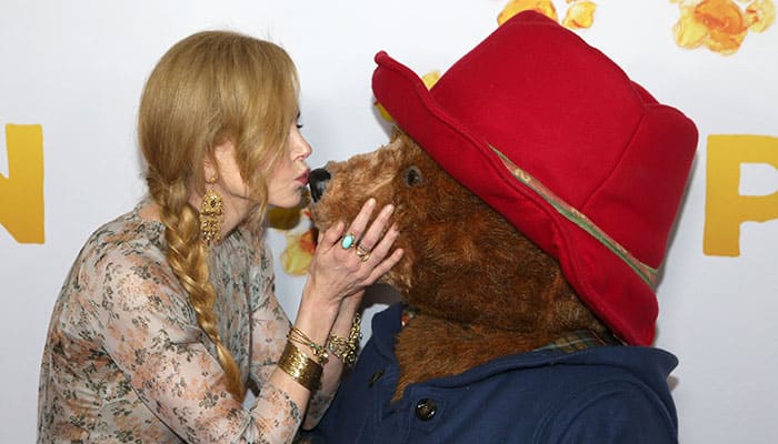 Actress Nicole Kidman, left, kisses the nose of the character Paddington as she arrives for the Australian premiere of her movie 'Padington' in Sydney.