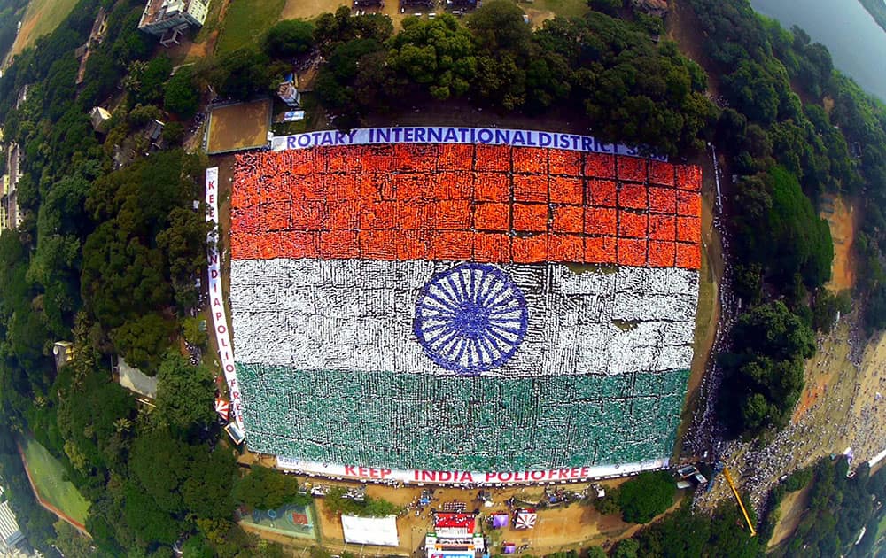 An aerial view of the Indian national flag formed by volunteers that created a new Guinness World Record for the largest human flag formation, at Nandanam YMCA ground in Chennai.