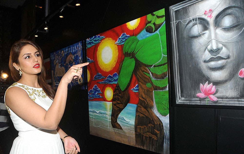 Bollywood actress Huma Qureshi attend an art auction for charity by Nikhar Tandon, in Mumbai.