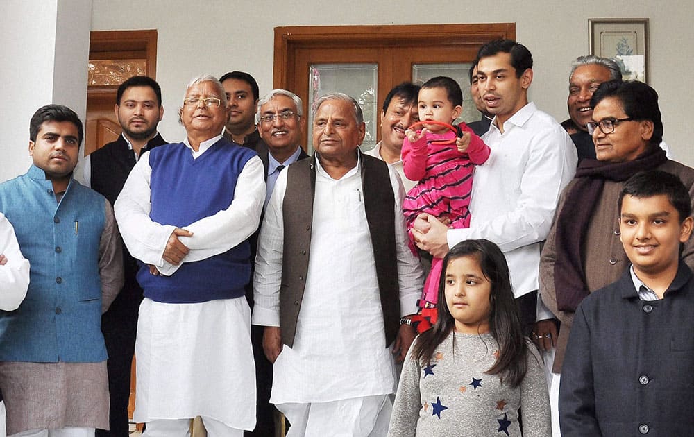 SP chief Mulayam Singh Yadav with RJD chief Lalu Prasad Yadav and Lok Sabha MP Tej Pratap during the pre wedding ceremony of Lalus daughter Raj Lakshmi with Mulayams grandson MP Tej Pratap, in Lucknow.