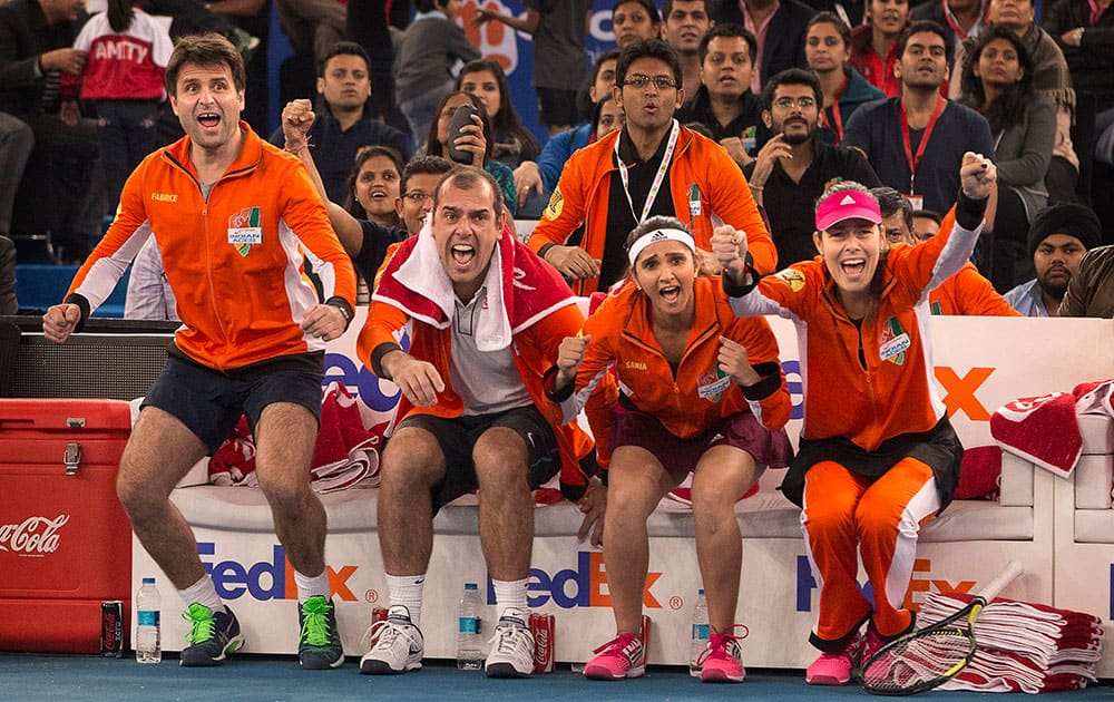 Micromax Indian Aces players from left, Fabrice Santoro, Cedric Pioline, Sania Mirza and Ana Ivanovic celebrate as soon as their team members Gael Monfils and Rohan Bopanna beat Manila Mavericks players Treat Huey and Daniel Nestor, in men's double during International Premier Tennis League, in New Delhi.