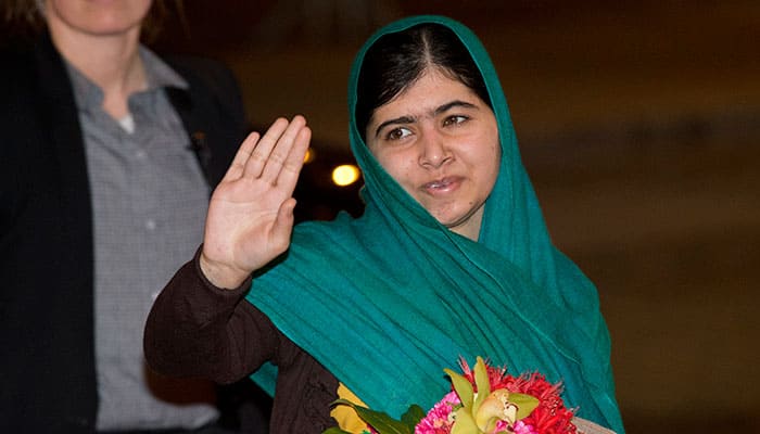 Joint-Nobel Peace Prize winner Malala Yousafzai waves at the media as she arrives at her hotel after flying to Oslo, Norway. The Nobel Peace Prize will be presented and shared between the youngest Nobel Prize winner ever, Taliban attack survivor Malala Yousafzai and Indian children's rights activist Kailash Satyarthi in a ceremony in Oslo on Wednesday. 