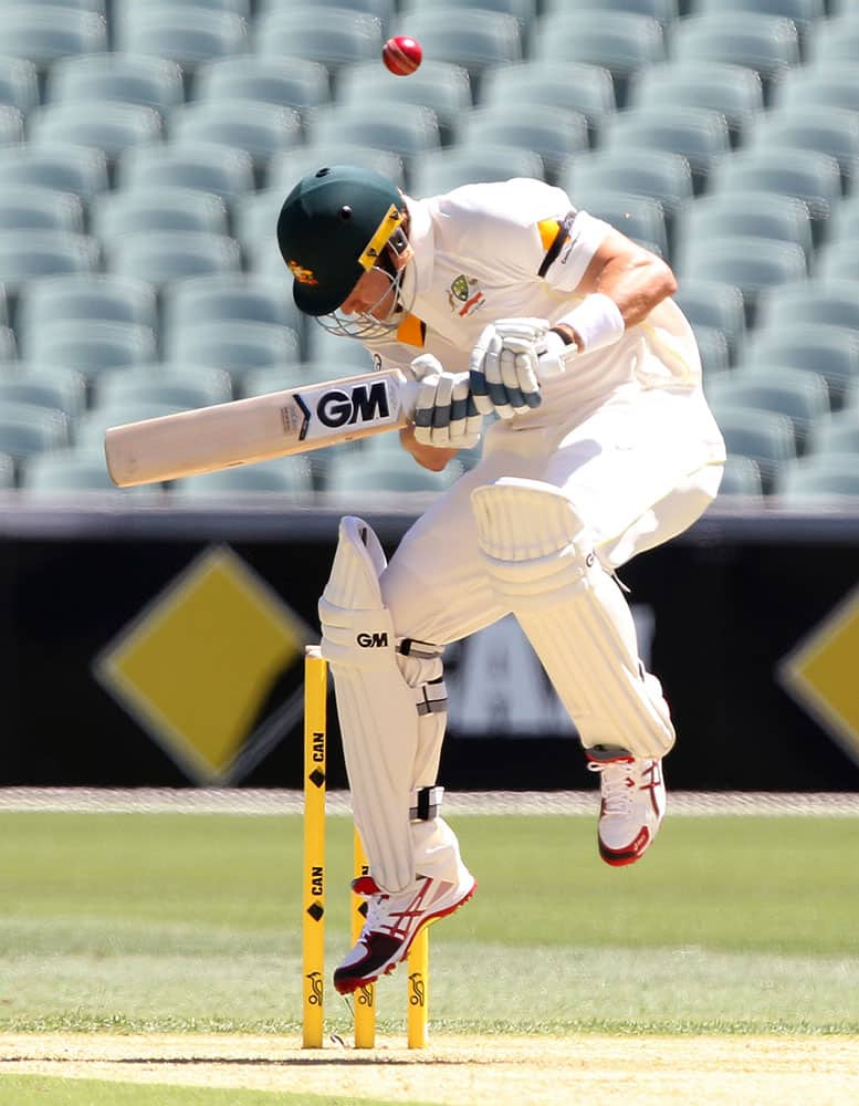 Australia's Shane Watson jumps as a ball flies over his head on the first day of a cricket test match against India in Adelaide, Australia.