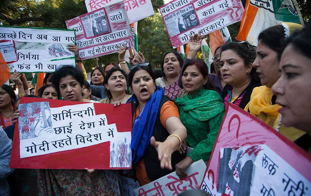 India’s opposition Congress party’s women activists shout slogans during a protest after a woman was allegedly raped by a taxi driver in New Delhi.