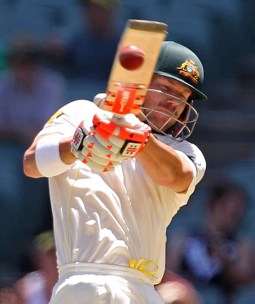 Australia's David Warner pulls the ball during the first day of the cricket match against India in Adelaide, Australia.