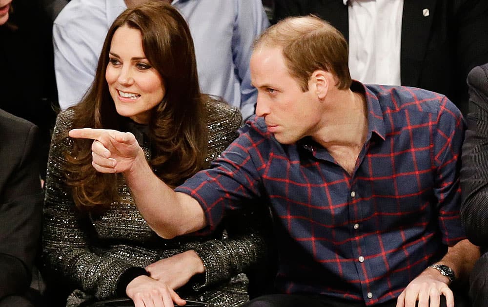 Britain's Prince William, right, and Kate, Duchess of Cambridge, watch the second half of an NBA basketball game between the Brooklyn Nets and the Cleveland Cavaliers, in New York.