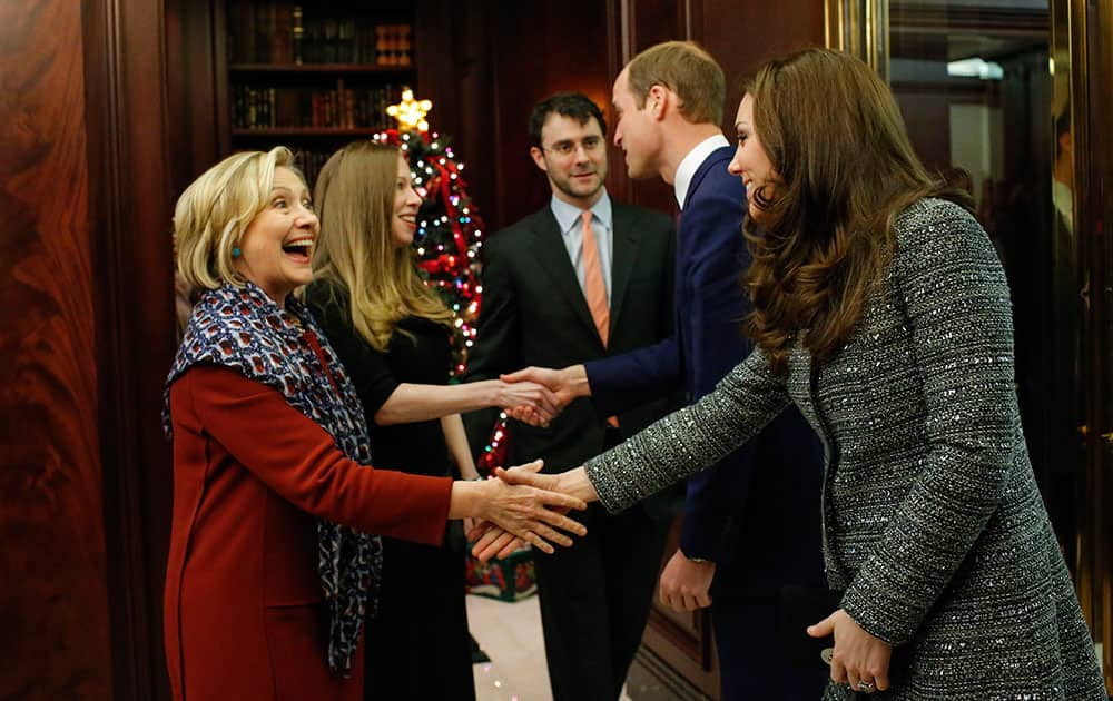 Kate, the Duchess Of Cambridge, right, shakes hands with Hillary Rodham Clinton while attending a reception with Prince William, second from right, co-hosted by the Royal Foundation and the Clinton Foundation at British Consul General's Residence in New York.