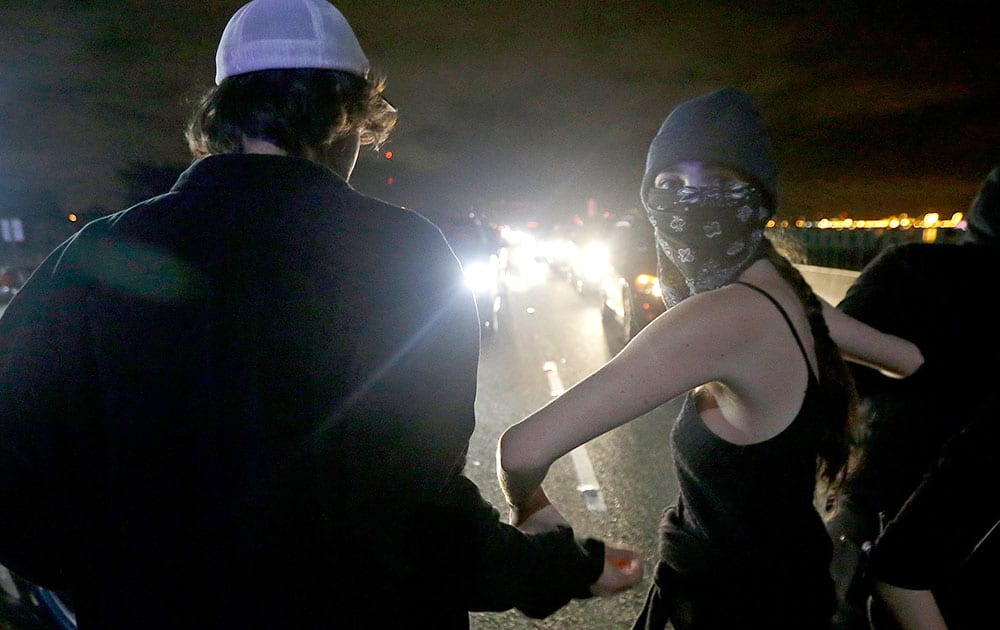 Protesters block traffic on Highway 80 during a protest in response to police killings in Missouri and New York in Berkeley, Calif.