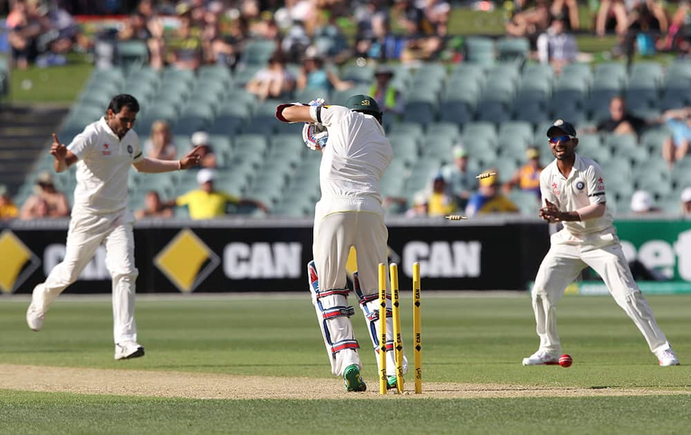 Mohammed Shami, bowls Australia's Nathan Lyon, during the first day of the cricket match in Adelaide, Australia.