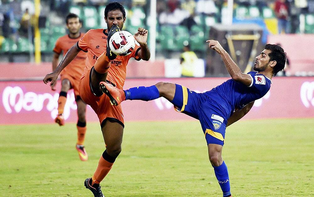 Players of Chennaiyin FC and Delhi Dynamos FC in action during their ISL match in Chennai.