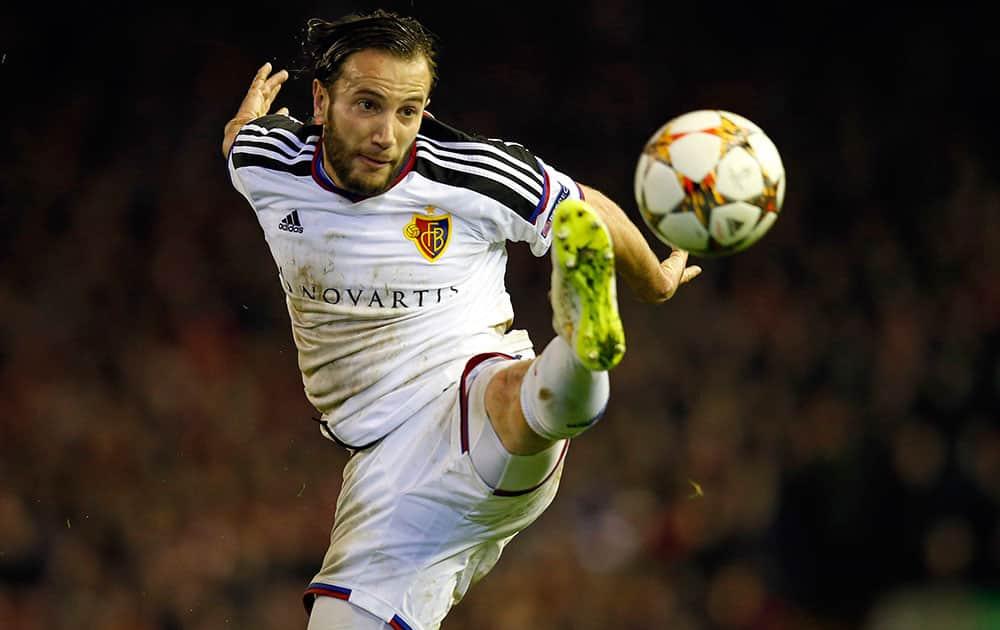 Basel's Shkelzen Gashi clears the ball during the Champions League Group B soccer match between Liverpool and FC Basel at Anfield Stadium in Liverpool, England.