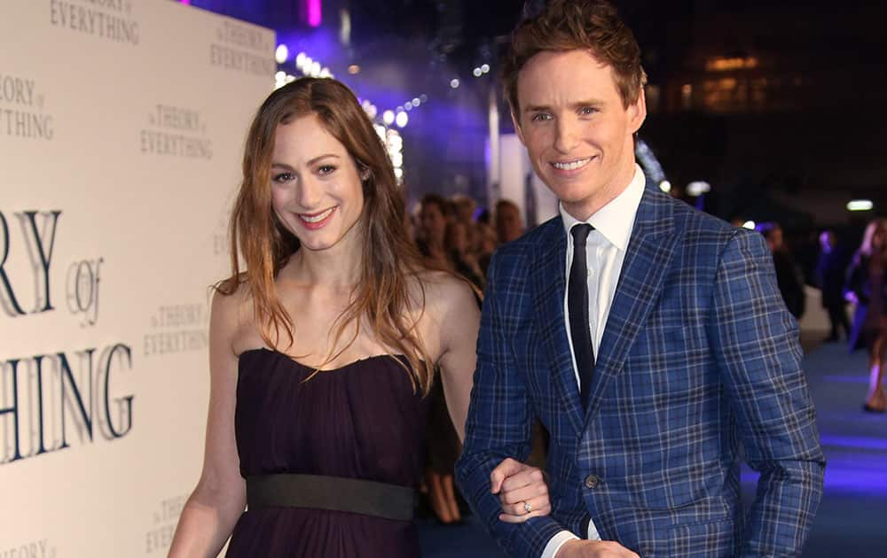 Actor Eddie Redmayne and Hannah Bagshawe arrive on the blue carpet for the UK premiere of The Theory Of Everything at the Odeon in Leicester Square, central London