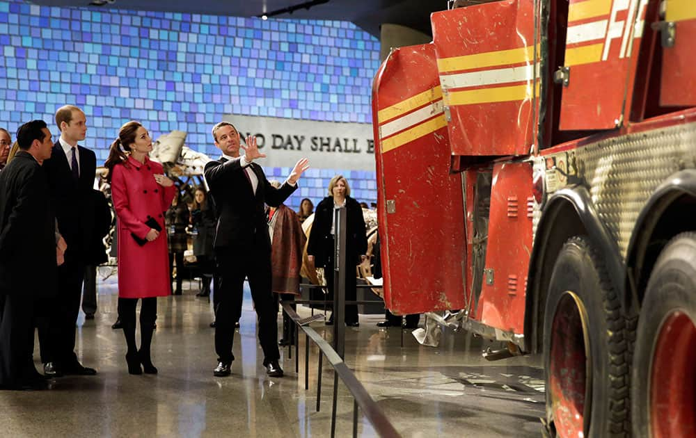 Kate, Duchess of Cambridge, and Britain's Prince William, second left, with Joe Daniels, center, president & CEO of the National September 11 Memorial and Museum view the remains of Fire Dept. of New York Ladder 3, during their visit to the National September 11 Museum.